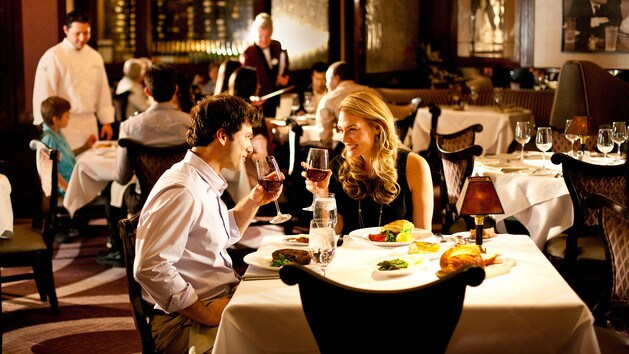 A couple dining at Steakhouse 55 at Disneyland Hotel in California